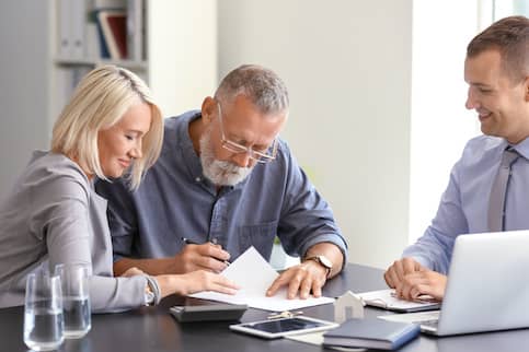 A senior couple reviewing va loan benefits